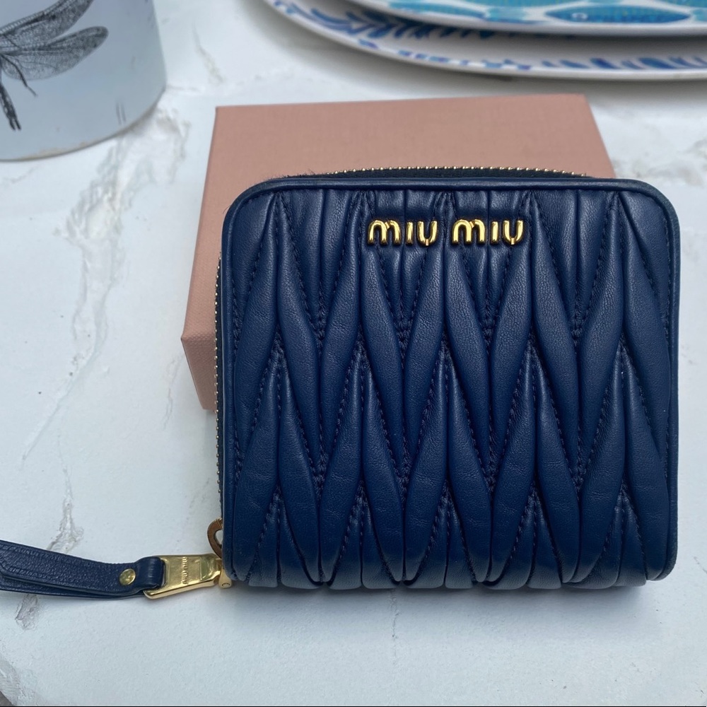 Miu Miu matelassé fold out purse.
